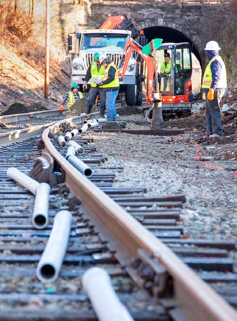 A crew prepares to install track signal communication line near Walpole Station on the Franklin Line of the Commuter Rail (January 2020)