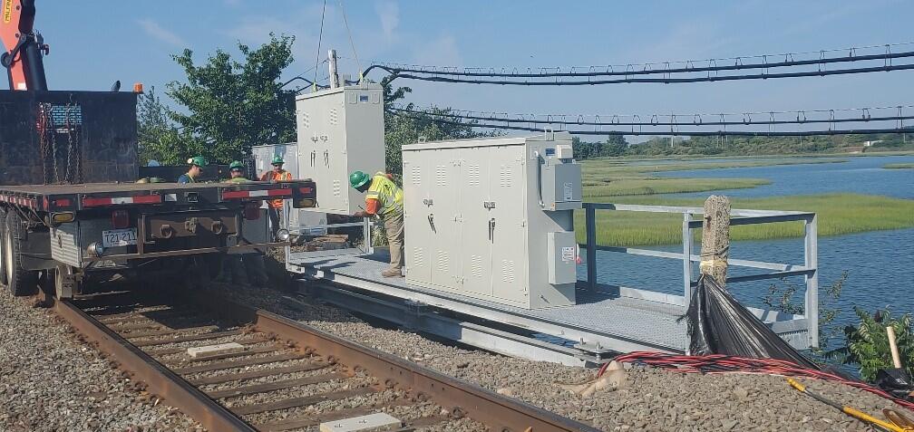 Crews install ATC signal house cases at Saugus Draw