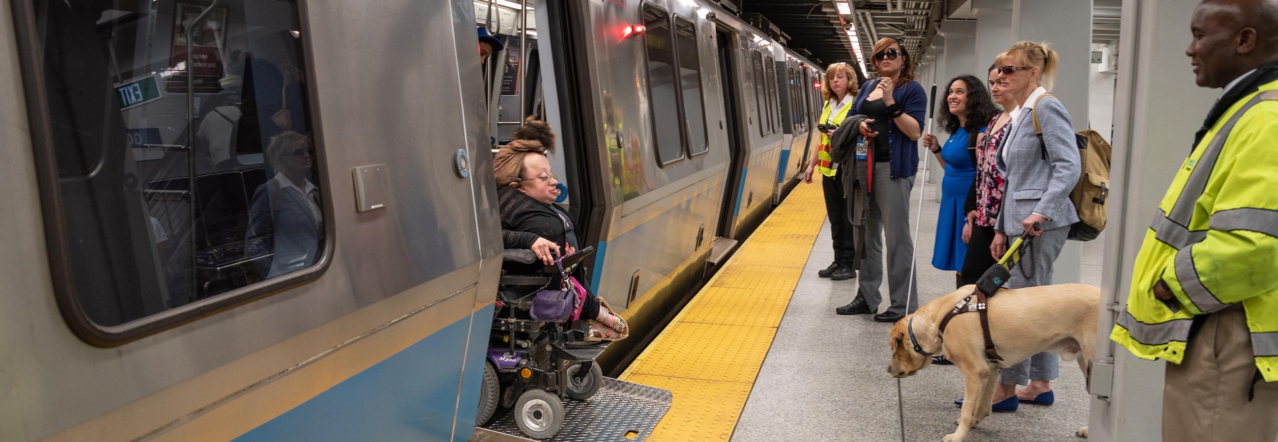 Rider in Wheeled Mobility Device Exiting Blue Line Train with Bridgeplate
