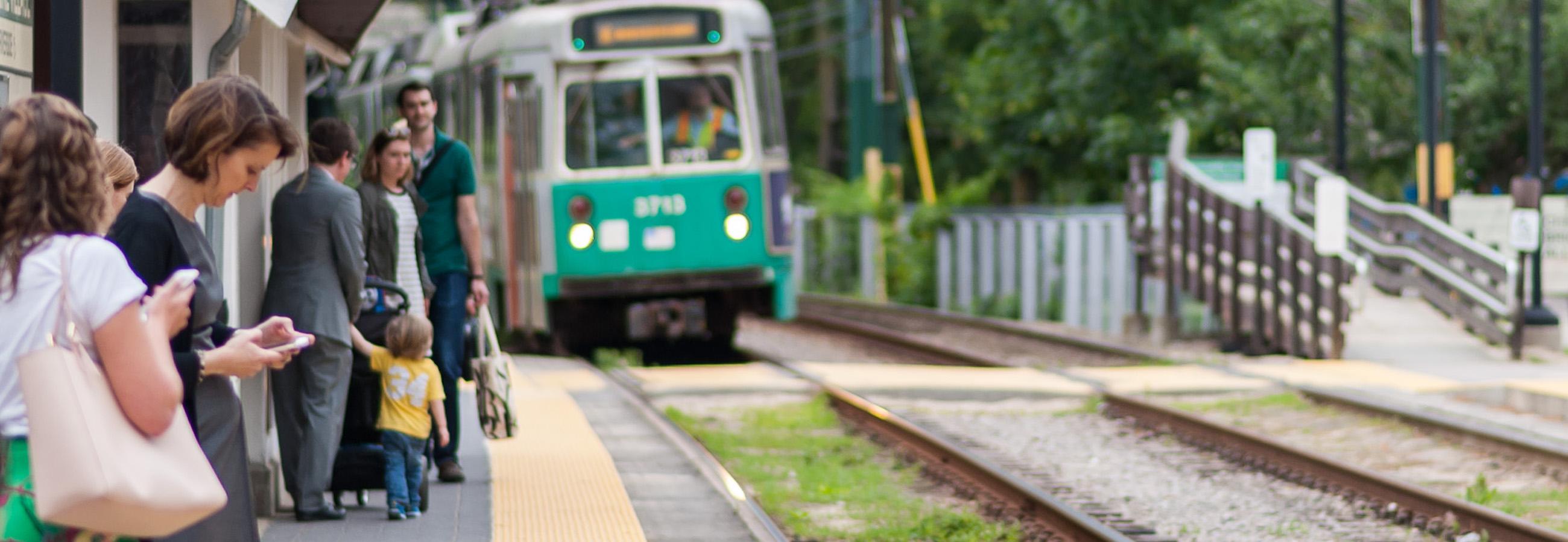 Green Line customers wait at stop
