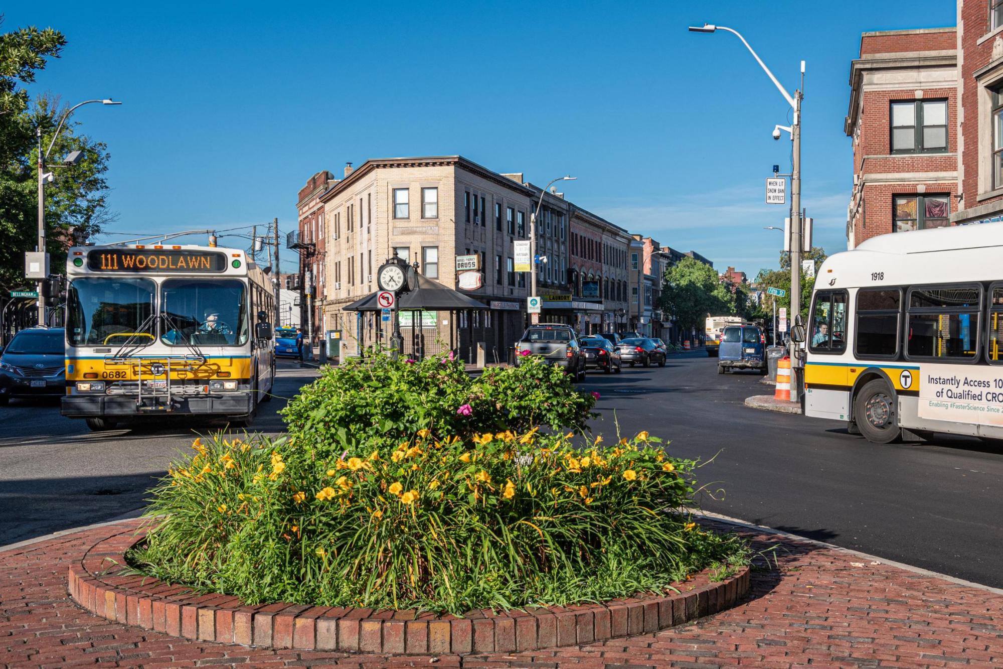 Route 111 Bus in a roundabout in Chelsea, during summertime