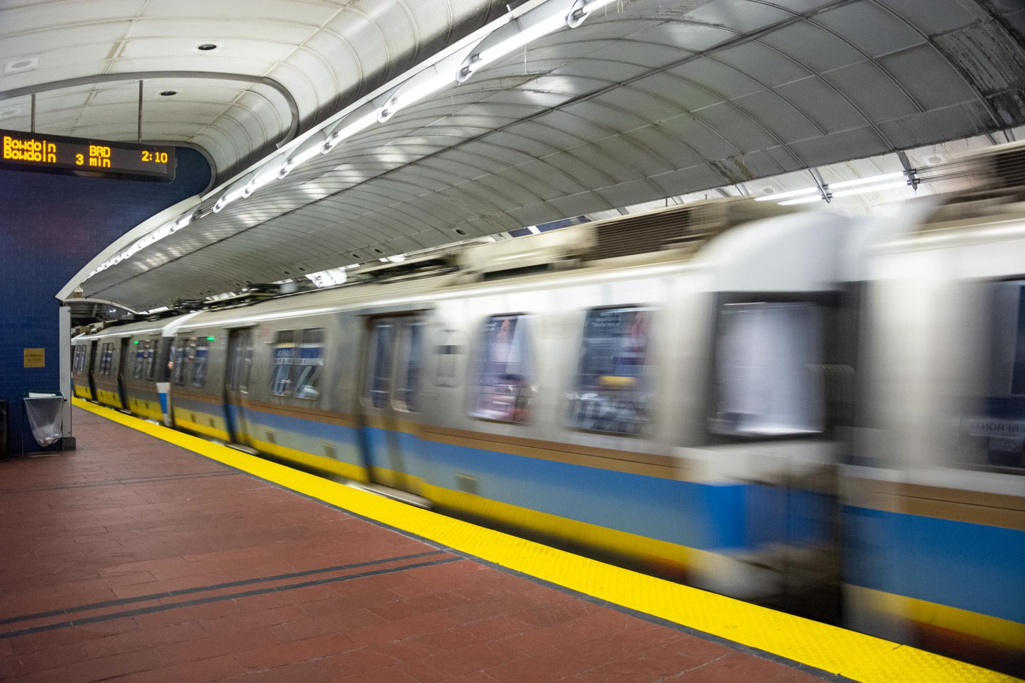A Blue Line train passes through Aquarium station