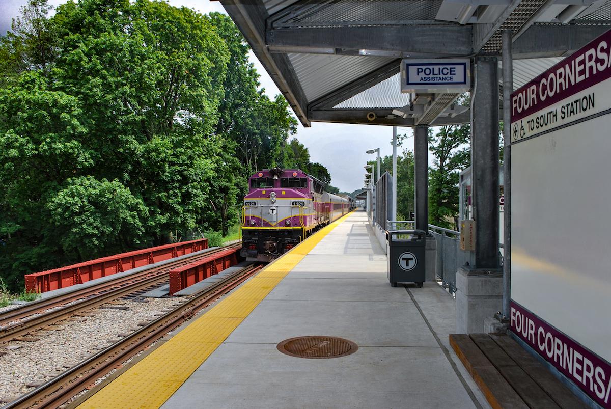 A Commuter Rail train approaches Four Corners Station on the Fairmount Line