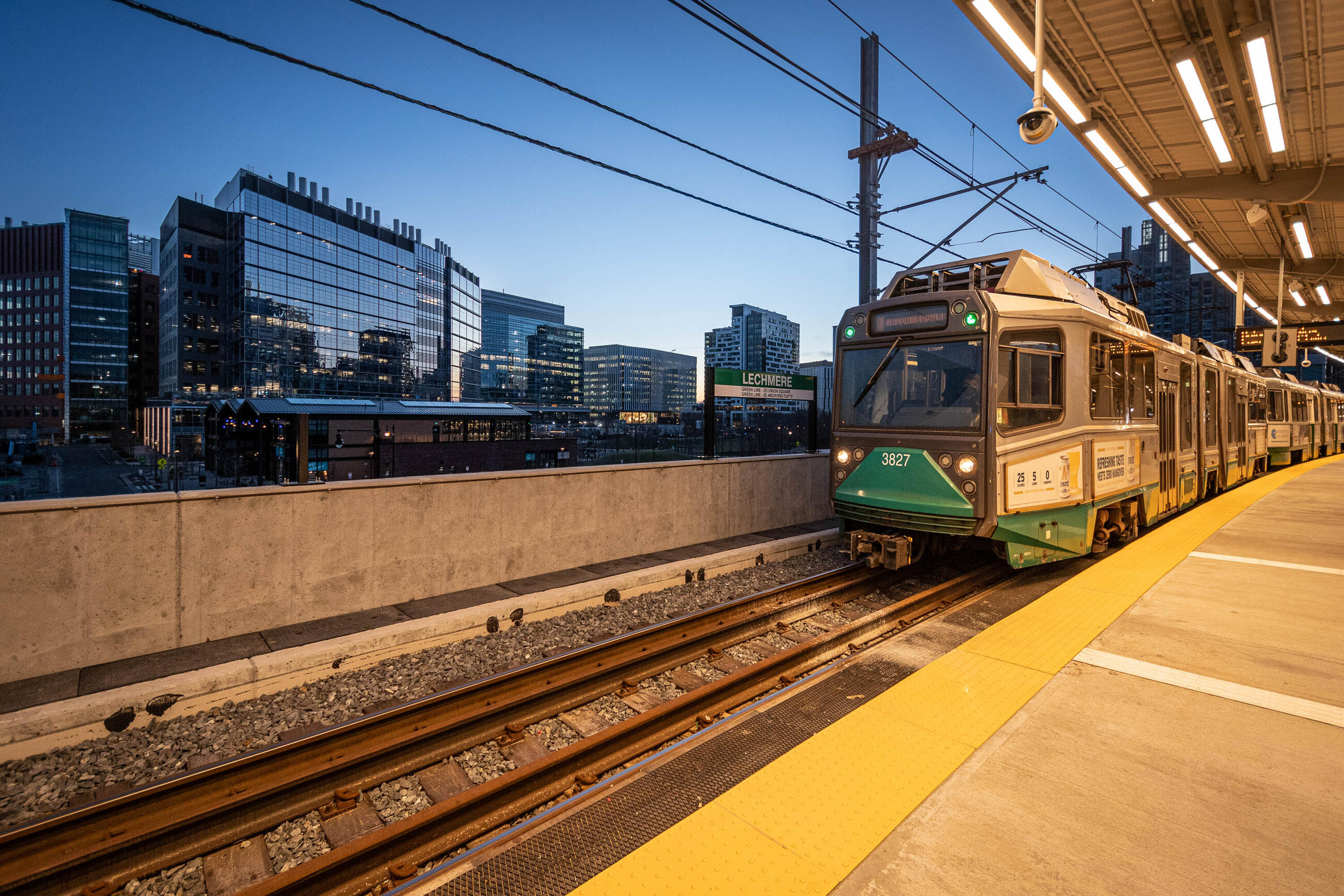 A Green Line train approaches Lechmere at dusk (March 2022)