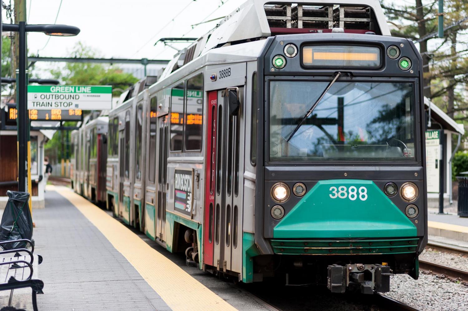 A Green Line train pulls into a station